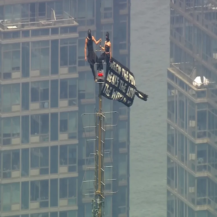 Empire state climbers face charges