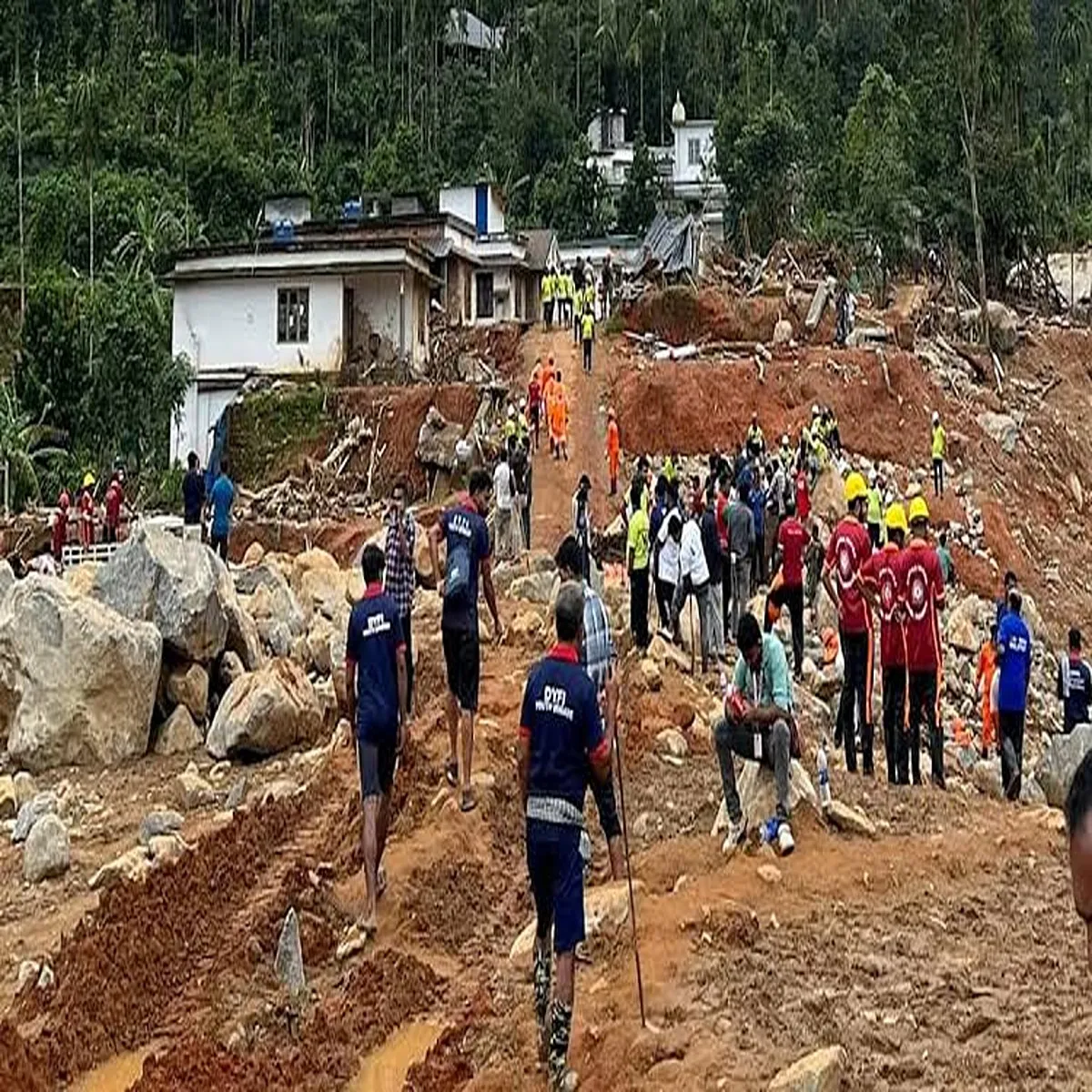 Landslide rescue teams search family after