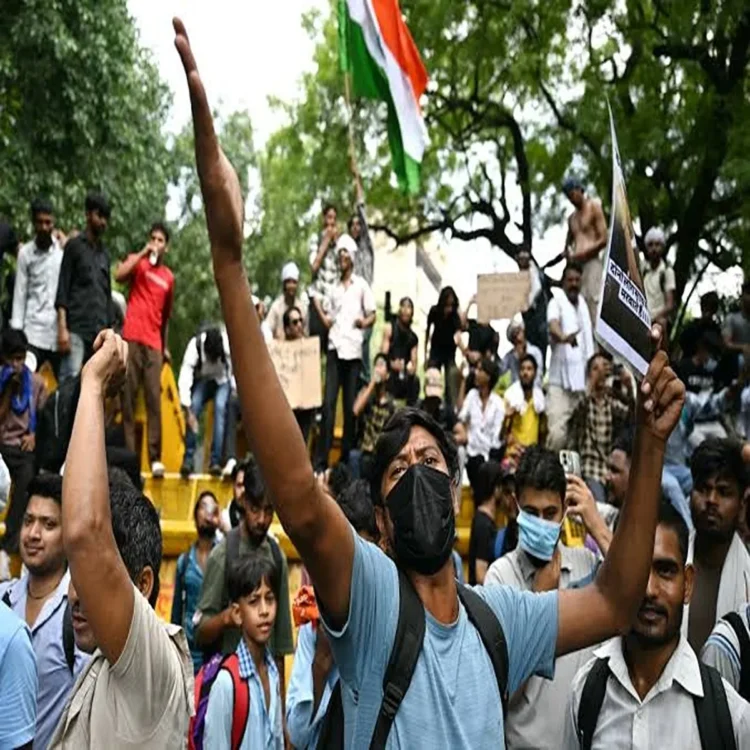 Pm modi vows action on exam fraud protests